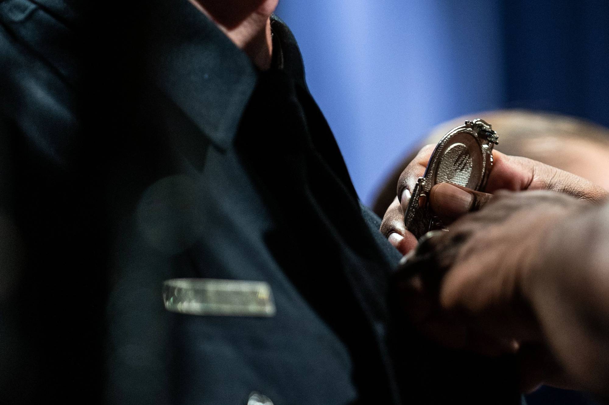 picture of badge being put on new officer. Click to see criminal justice minor